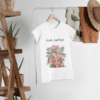 mockup-of-a-women-s-t-shirt-hanged-next-to-some-plant-pots-and-other-garments-27395 (5) Kaafi Sanskari Graphic Tshirt
