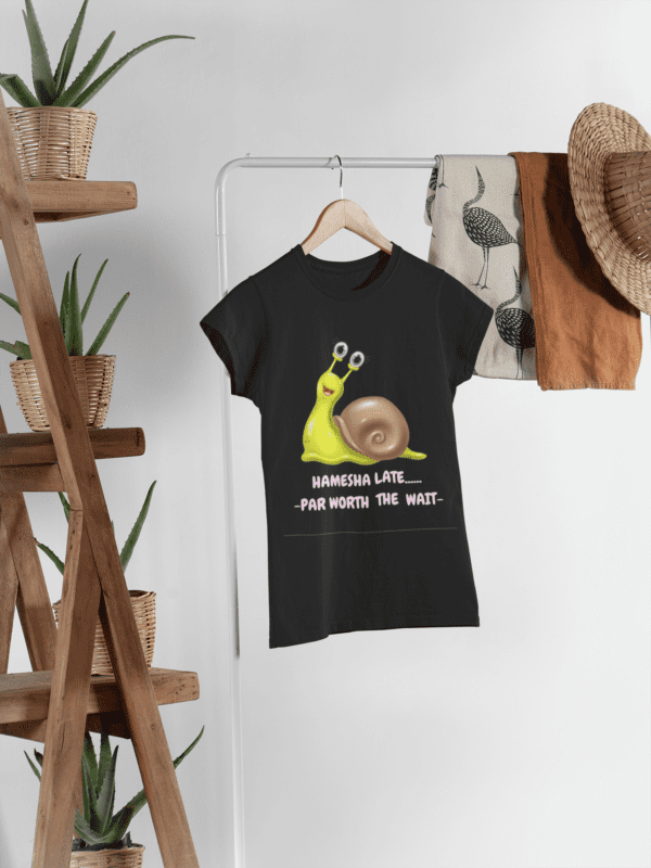 mockup-of-a-women-s-t-shirt-hanged-next-to-some-plant-pots-and-other-garments-27395 (2) Quirky "Hamesha Laate" Graphic T Shirt